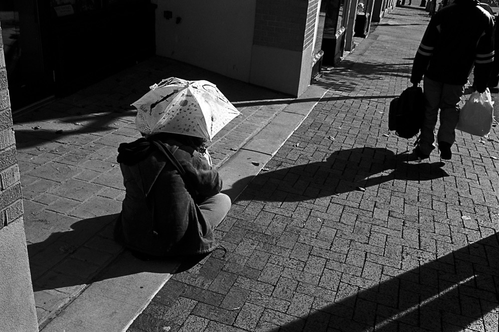 Woman and child with umbrella, 2008