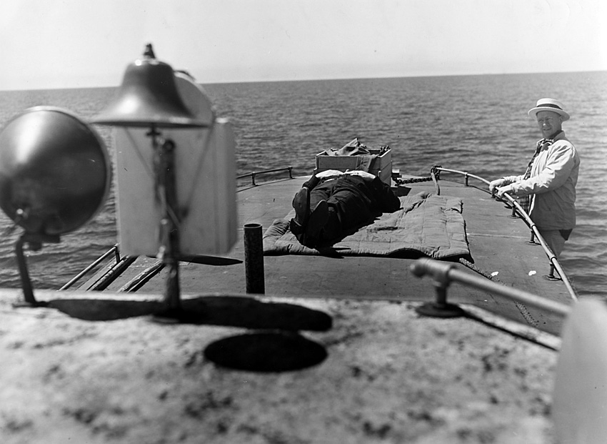 Anonymous Photo: A Man Sleeps on a Boat