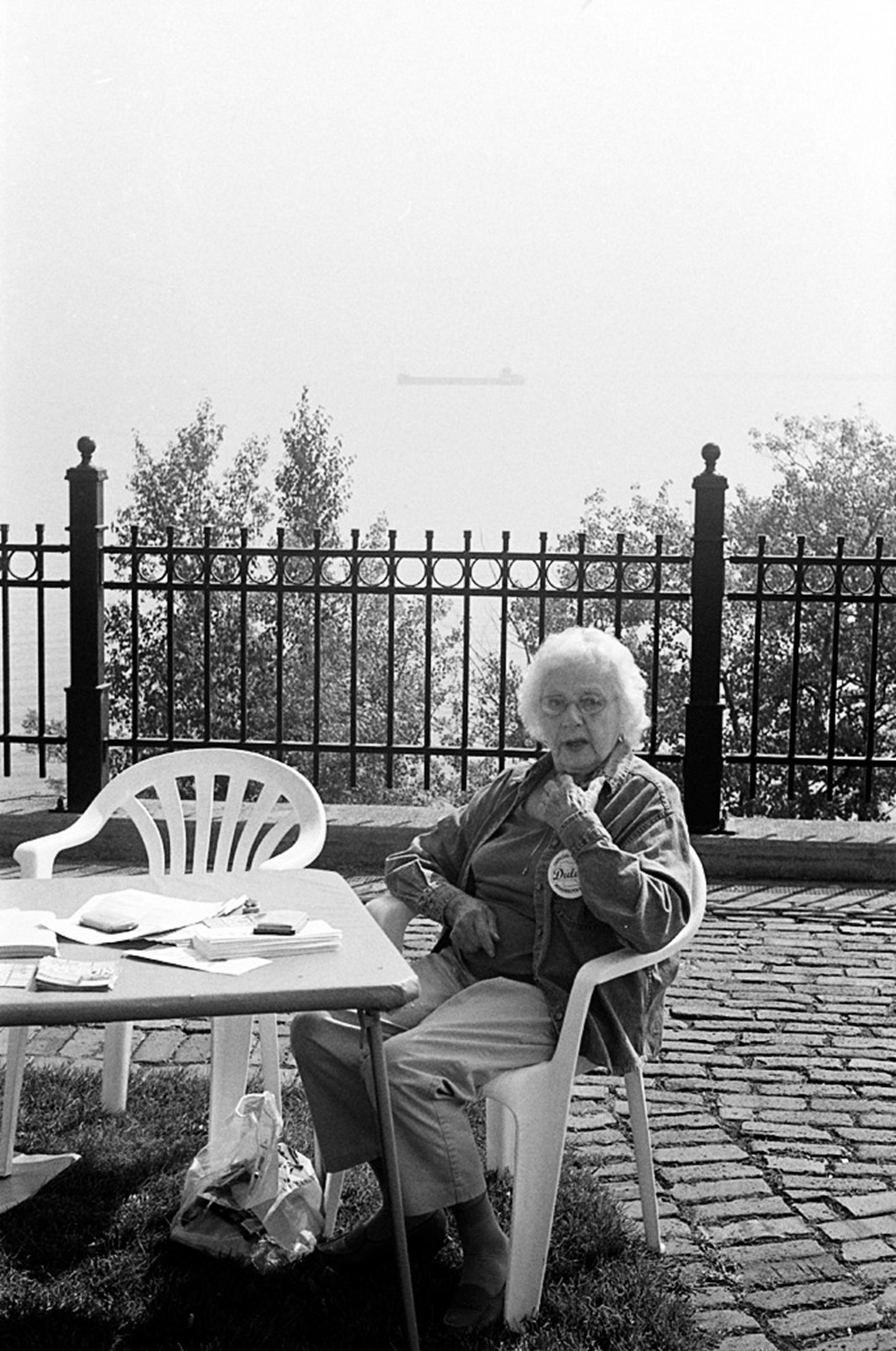 A Woman Sits Near The Lake