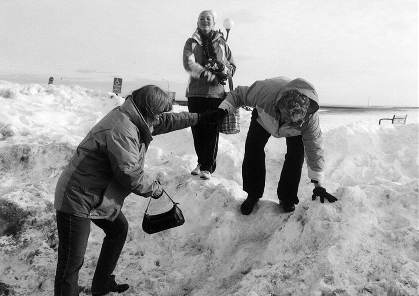 Climbing a snowbank to reach a parking lot, Duluth, Minnesota, January 2008