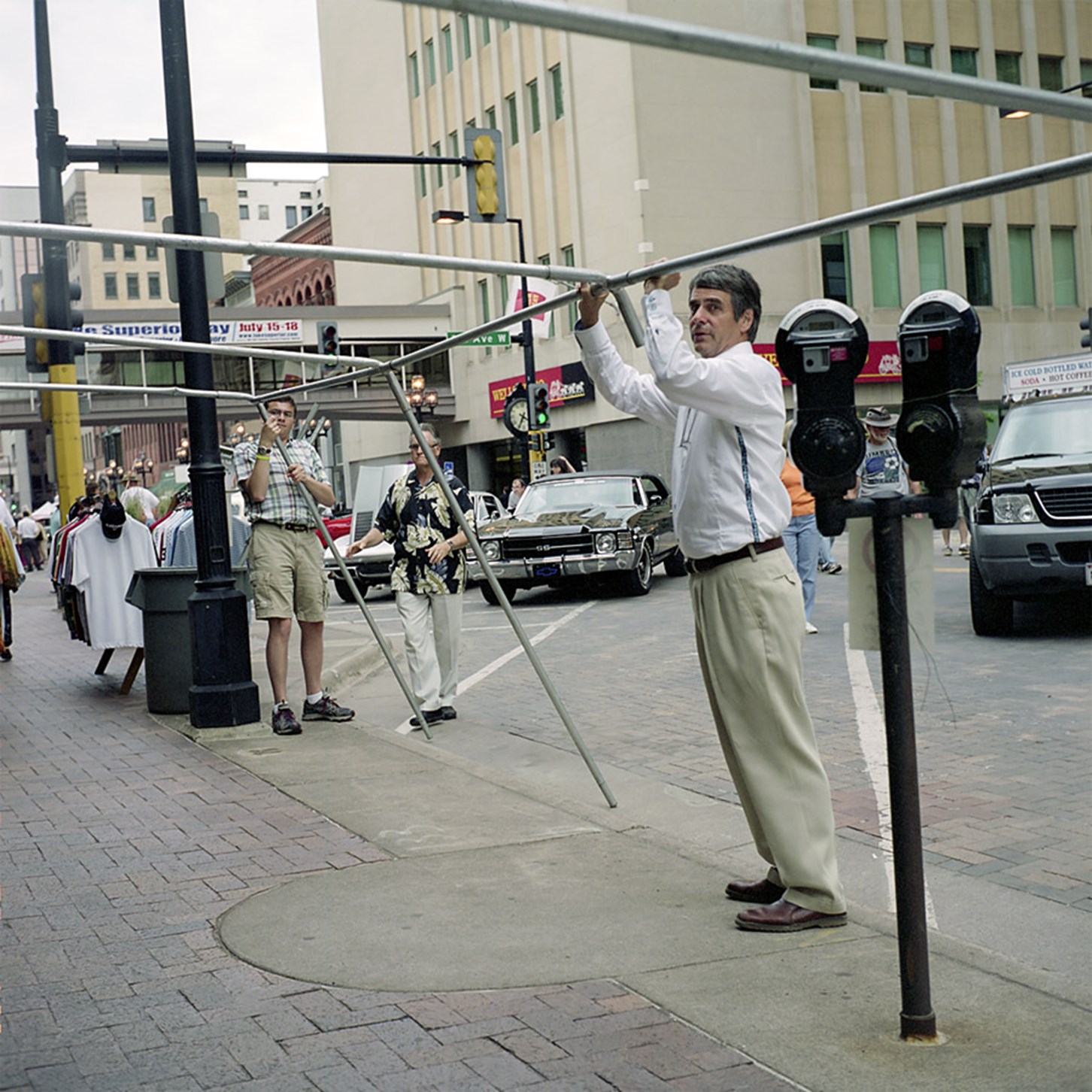 A Man Holding Up Some Pipes, Duluth, Minnesota, July 2010