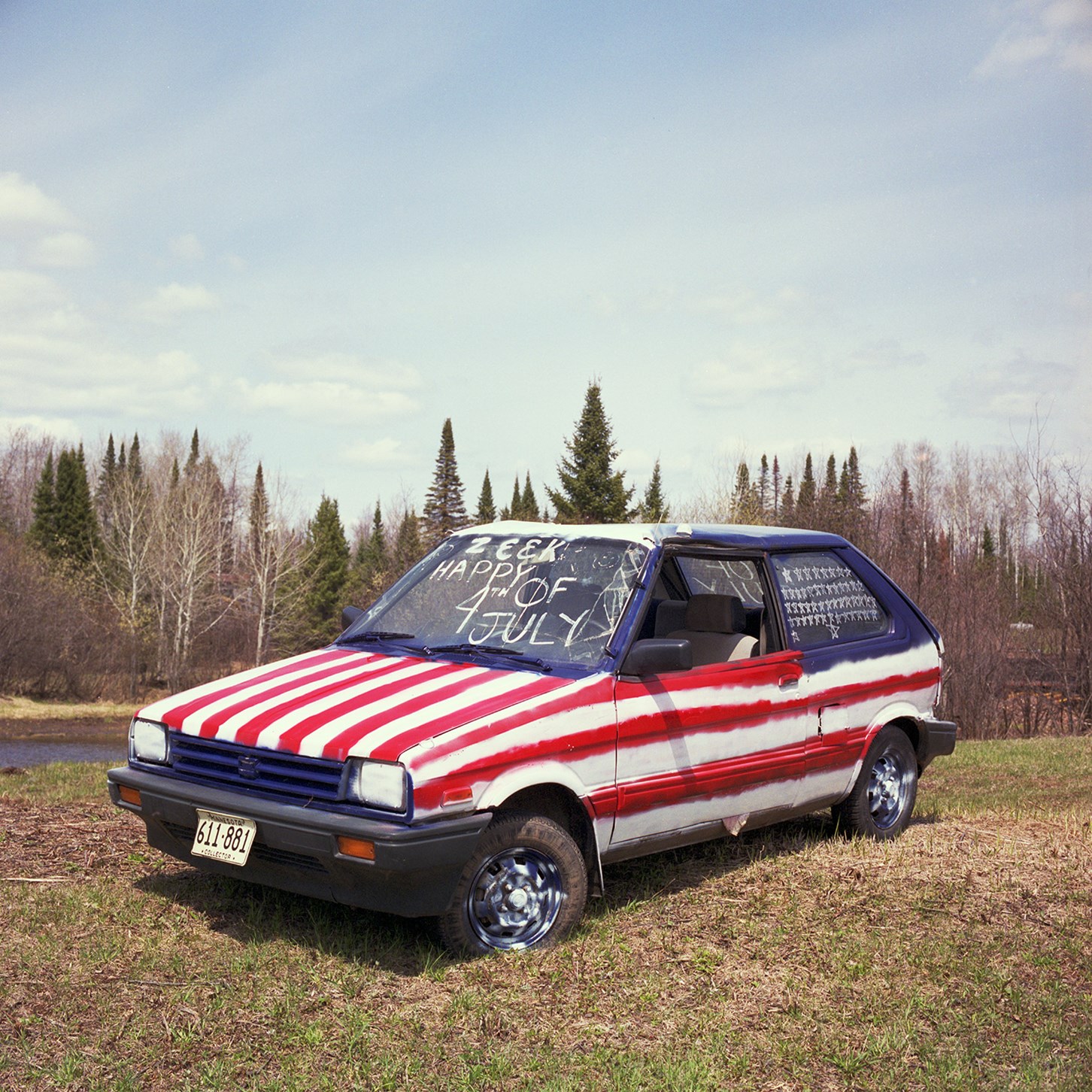Suburu Justy Painted As An American Flag Photograph by K