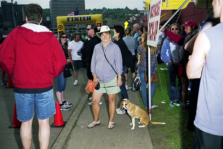 A Woman With A Dog With A Folded Over Ear