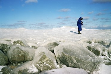 A Woman Walks On Ice