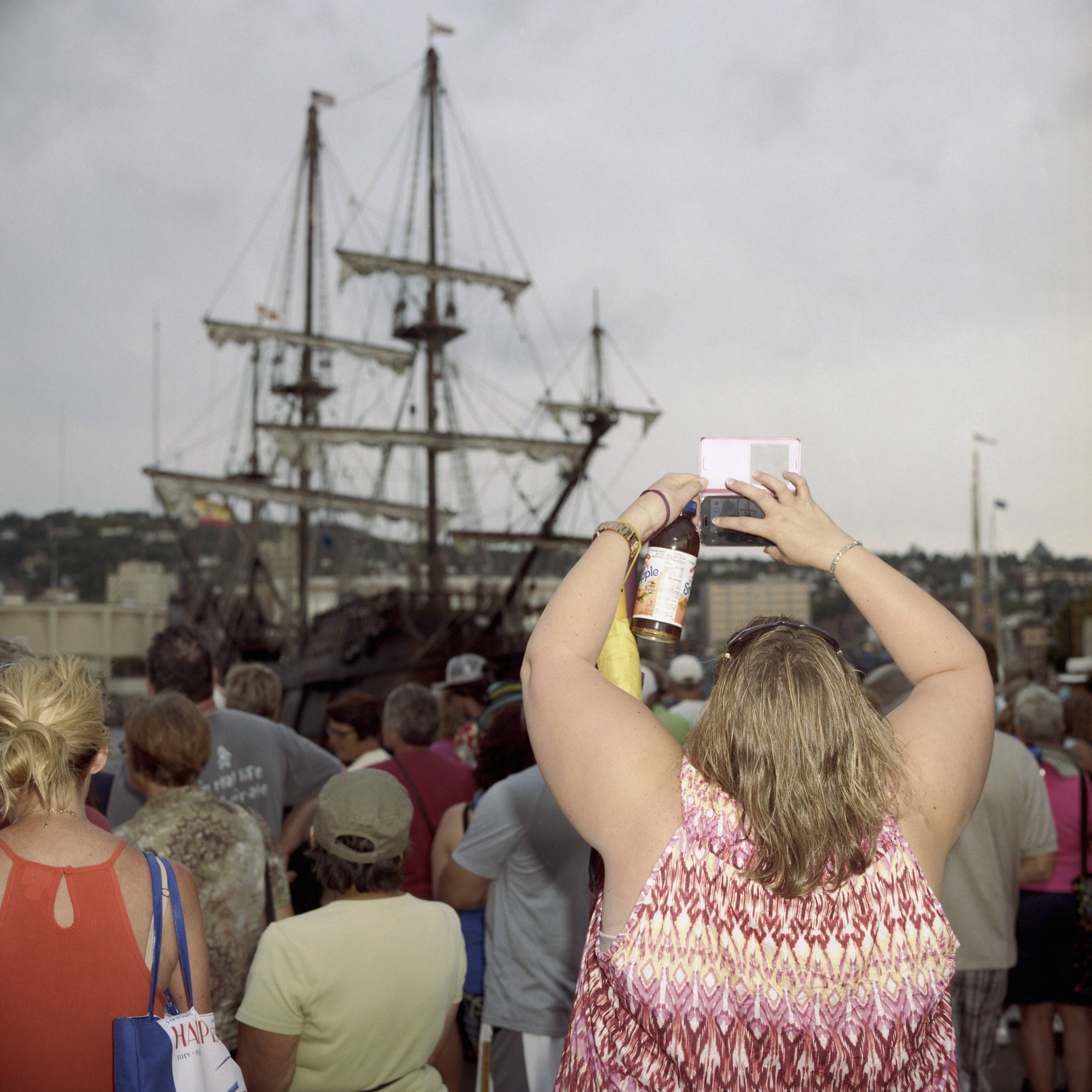 A Woman Takes A Smartphone Photo Of A Tall Ship, Duluth, Minnesota, August 2016