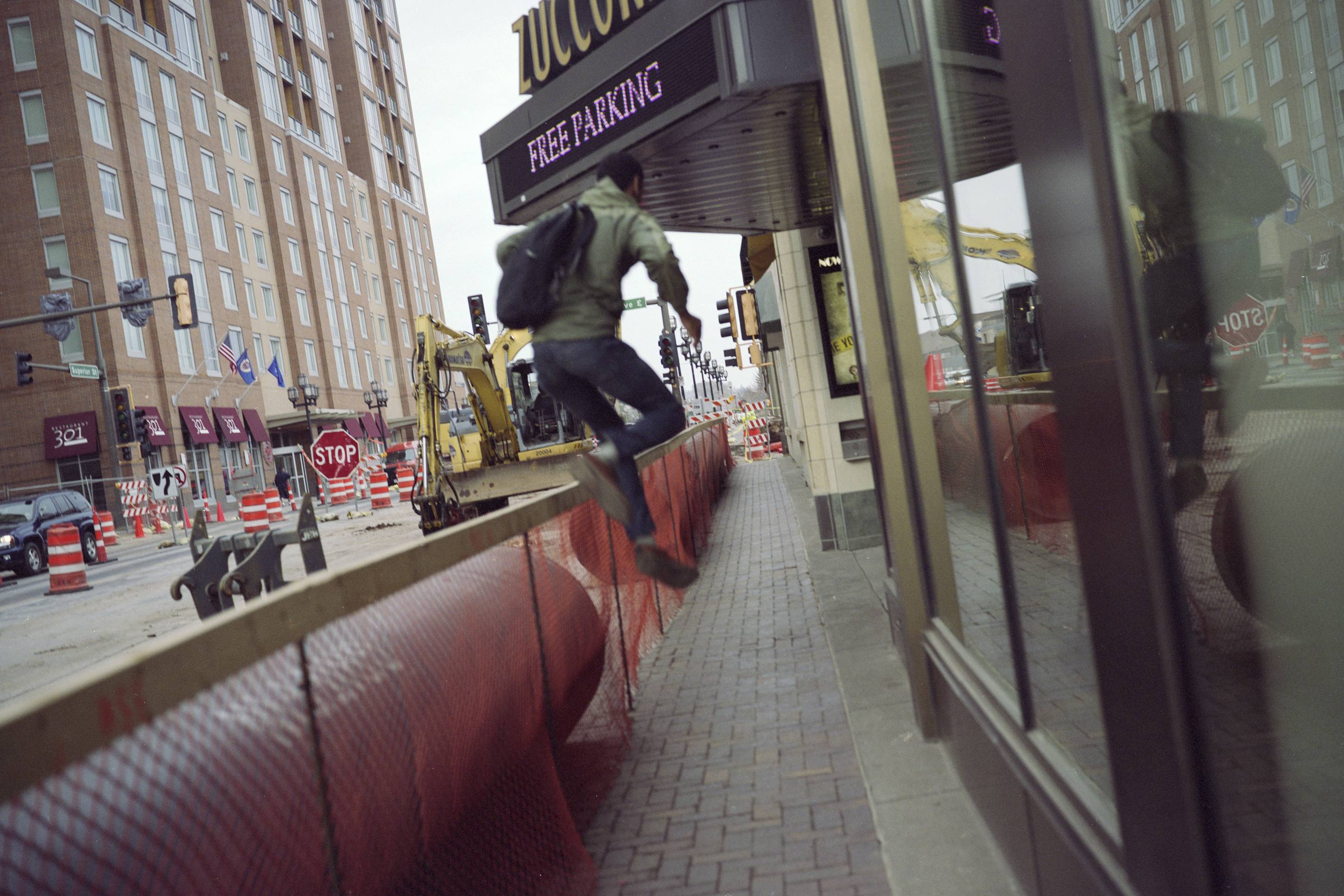 Man Leaping Over A Construction Barricade, Duluth, Minnesota, May 2011
